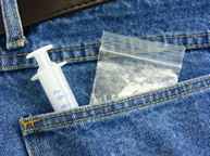 Back pocket with drugs nd needle