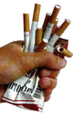 Cigarette pack crushed in hand