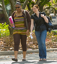 Two students walking through campus